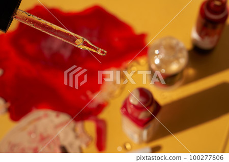 Blood plasma as a solution of the drug for plasmolifting therapy. Transparent pipette on a blurry background of blood. Selective focus. The concept of health and beauty. High quality photo Blood plasma as a solution of the drug for plasmolifting therapy. Transparent pipette on a blurry background of blood. Selective focus. The concept of health and beauty. High quality photo 100277806