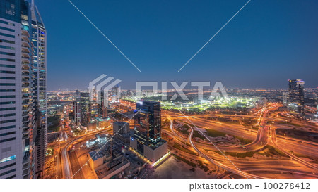 Aerial view of media city and al barsha heights district area day to night timelapse from Dubai marina. Aerial view of media city and al barsha heights district area day to night timelapse from Dubai marina. 100278412