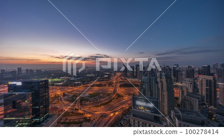 Huge highway crossroad junction between JLT district and Dubai Marina night to day timelapse. Huge highway crossroad junction between JLT district and Dubai Marina night to day timelapse. 100278414