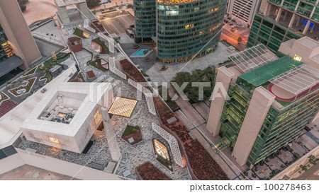 Dubai international financial center skyscrapers aerial night to day timelapse. 100278463