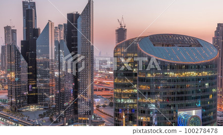 Dubai international financial center skyscrapers aerial day to night timelapse. 100278478