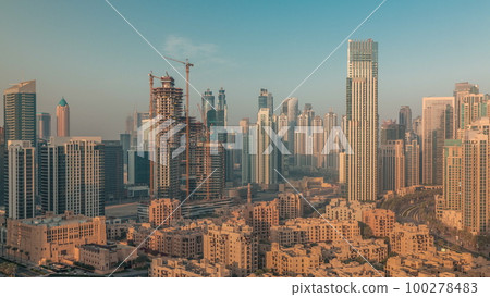Dubai's business bay towers aerial morning timelapse. Rooftop view of some skyscrapers 100278483