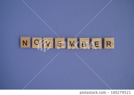 The name of the month of November is written on wooden cubes isolated. Top view of wooden blocks with letters The name of the month of November is written on wooden cubes isolated. Top view of wooden blocks with letters 100279521