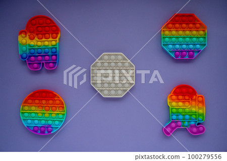 Trendy pop it toys in form of geometric figures, and a character among us on a Very Peri background. Games for kids Trendy pop it toys in form of geometric figures, and a character among us on a Very Peri background. Games for kids 100279556