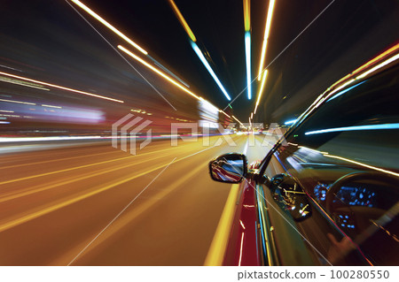 Long exposure of a speedy night drive in a big city Long exposure of a speedy night drive in a big city 100280550