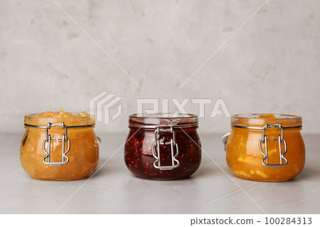 Different delicious homemade jams on light table Different delicious homemade jams on light table 100284313