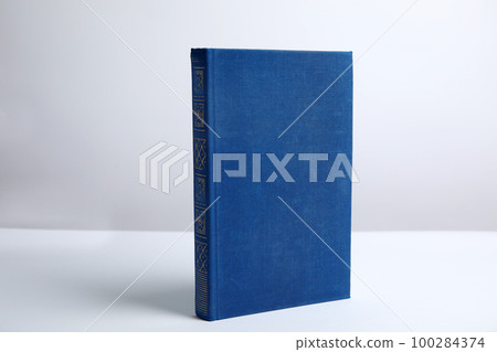Hardcover book on white background. Space for design 100284374