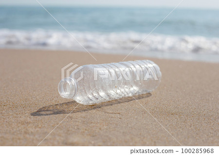 Plastic bottle on the beach 100285968