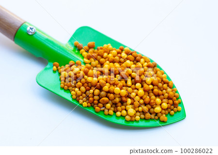 Yellow fertilizer plant food. High NPK 100286022