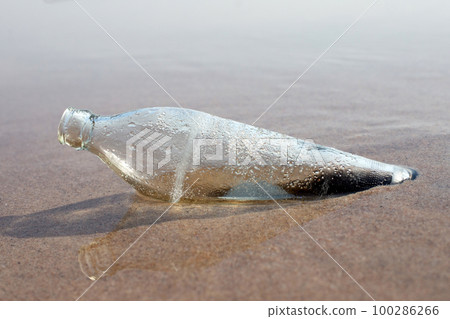 Glass bottle on the beach Glass bottle on the beach 100286266