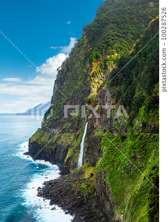 Beautiful view of Cascata do Veu da Noiva waterfall or Bridal Veil near Porto Moniz and Seixal. Madeira Island, Portugal Beautiful view of Cascata do Veu da Noiva waterfall or Bridal Veil near Porto Moniz and Seixal. Madeira Island, Portugal 100287526