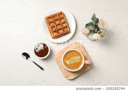 Flat lay composition with coffee on white wooden table. Tasty breakfast 100288744