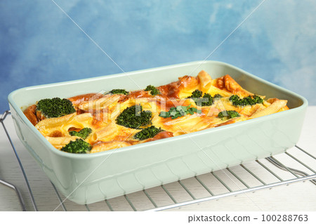 Tasty broccoli casserole in baking dish on cooling rack Tasty broccoli casserole in baking dish on cooling rack 100288763