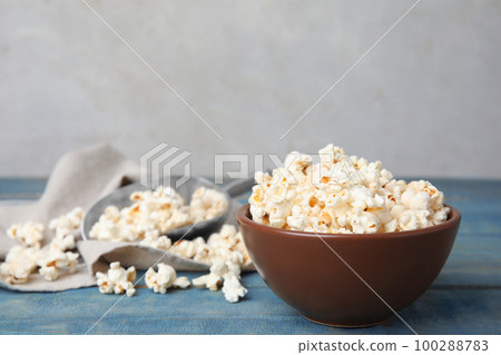 Tasty pop corn on blue wooden table Tasty pop corn on blue wooden table 100288783