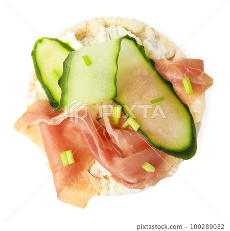 Puffed rice cake with prosciutto and cucumber isolated on white, top view 100289082