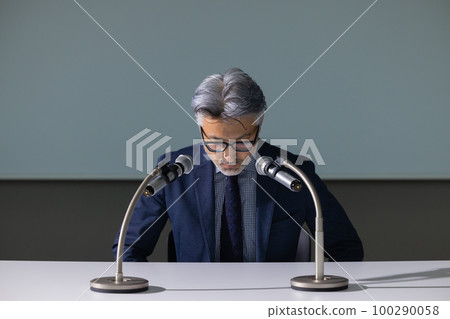 A man with gray hair who looks like an apology interview A man with gray hair who looks like an apology interview 100290058