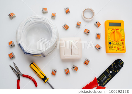working tools for an electrician on a white background. 100292128