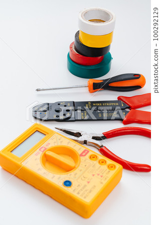 Stripper, Pliers, Multimeter, insulating tape and Screwdriver on a white. 100292129