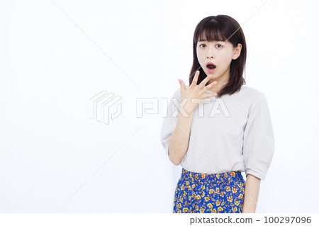 A woman in her thirties who is surprised A woman in her thirties who is surprised 100297096