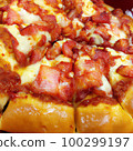Beautiful and appetizing pizza topped with cheese and sauce. Beautiful and appetizing pizza topped with cheese and sauce. 100299197