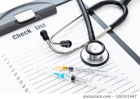 Stethoscope and check sheet white background 100301447