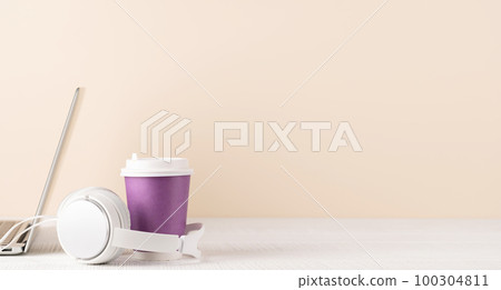 Laptop, headphones and coffee cup Laptop, headphones and coffee cup 100304811