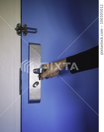 Hand with Door handle Hotel room security Hand with Door handle Hotel room security 100305012