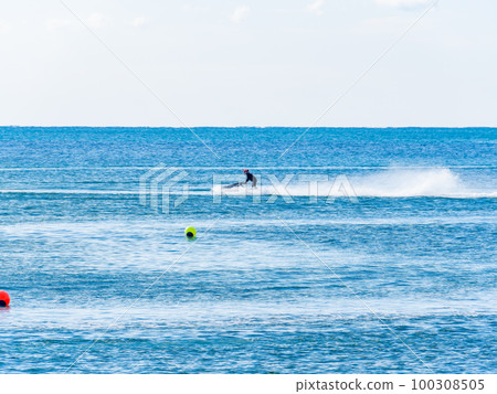 Exhilarating jet skiing in the Pacific Ocean at Byobugaura, Dover, Chiba, Japan 100308505