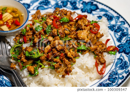 stir-fried basil with pork and fried egg stir-fried basil with pork and fried egg 100309347