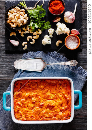 tasty Cauliflower casserole in a blue baking dish tasty Cauliflower casserole in a blue baking dish 100311940