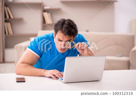 Young man freelancer working from home Young man freelancer working from home 100312319