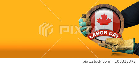 Canadian Labor Day Concept - Gloved Hands Holding a Flag of Canada Canadian Labor Day Concept - Gloved Hands Holding a Flag of Canada 100312372