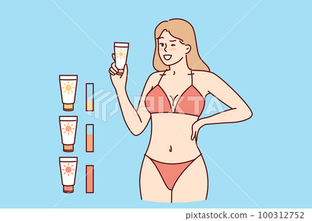 Woman in beach tanning bikini demonstrates anti-sunburn cream for visiting solarium 100312752