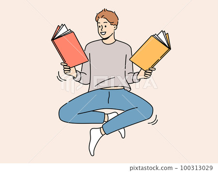 Smiling man floating in air reading books  100313029