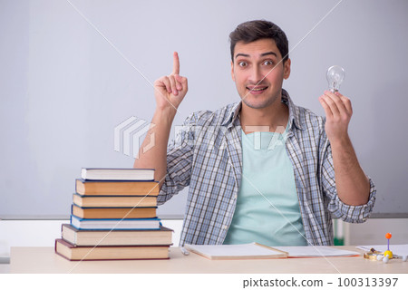 Young male student in happy idea concept Young male student in happy idea concept 100313397