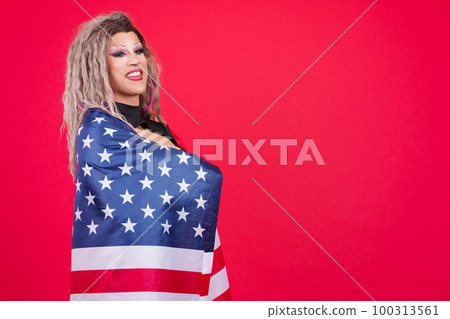 Distracted transgender person wrapping with a north america national flag Distracted transgender person wrapping with a north america national flag 100313561