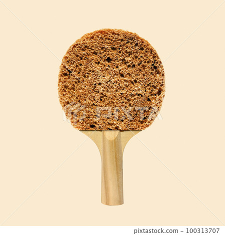 Playful collage round bread breakfast and tennis racket ping pong on a yellow background.  100313707