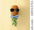 Playful pineapple in sunglasses and bow tie. Minimal concept of tropical fruits of summer and 100313721