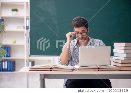 Young male teacher in tele-education concept Young male teacher in tele-education concept 100315519
