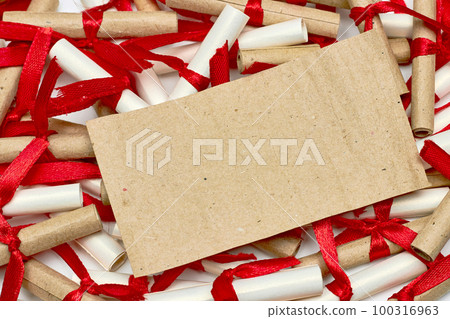 Romantic scrapbook letters love notes tied with a red satin ribbon Romantic scrapbook letters love notes tied with a red satin ribbon 100316963