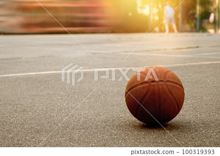 Basketball ball on the outdoor sports ground. Active lifestyle 100319393