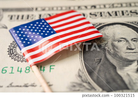 USA Amera flag on US dollar banknotes, import export finance business concept. 100321515