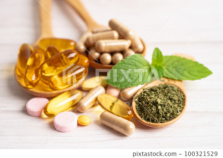Alternative medicine herbal organic capsule with vitamin E omega 3 fish oil, mineral, drug with herbs leaf natural supplements for healthy good life. 100321529