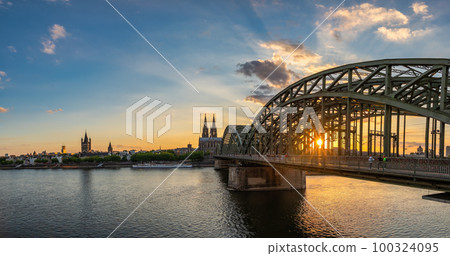 Cologne (Koln) Germany, sunset panorama city skyline at Cologne Cathedral (Cologne Dom) with Rhine River and Hohenzollern Bridge 100324095