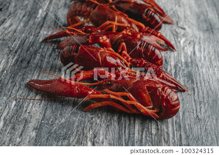 closeup of some cooked crayfish on a table 100324315