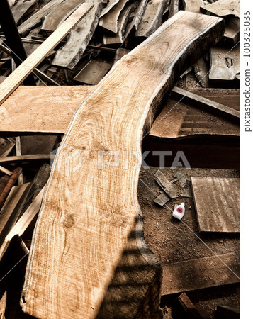 Pile of wooden planks in the timber factory 100325035
