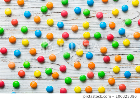 colorful candies as background top view. Seamless pattern with candy. Many sweet candies close-up colorful candies as background top view. Seamless pattern with candy. Many sweet candies close-up 100325386