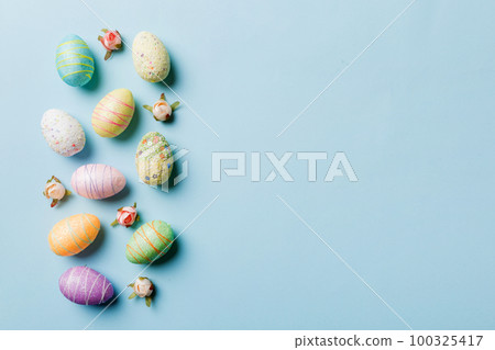 Happy Easter concept. Preparation for holiday. Easter eggs on colored background. flat lay top view copy space banner 100325417