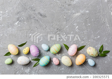 Happy Easter concept. Preparation for holiday. Easter eggs on colored background. flat lay top view copy space banner Happy Easter concept. Preparation for holiday. Easter eggs on colored background. flat lay top view copy space banner 100325571