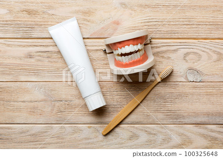 Mouthwash and other oral hygiene products on colored table top view with copy space. Flat lay. Dental hygiene. Oral care kit. Dentist concept 100325648